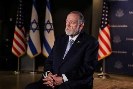 FILE PHOTO: U.S. Ambassador to Israel Mike Huckabee looks on