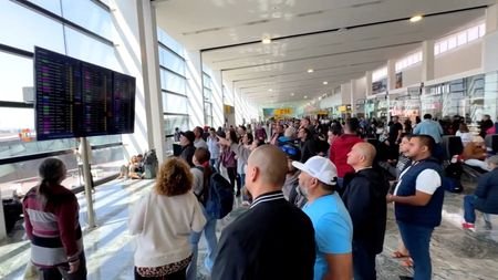 People gather at the Guadalajara International Airport, in Tlajomulco de