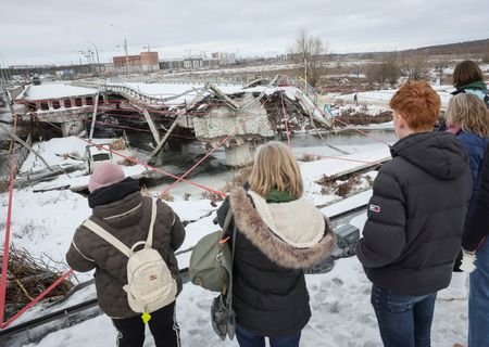 People attend a memorial event to mark the fourth anniversary