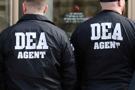 Members of the Drug Enforcement Administration (DEA) stand outside the