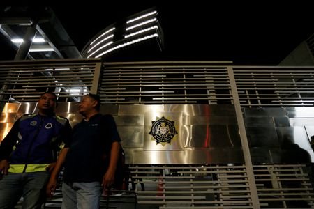 FILE PHOTO: Police officers stand guard outside the MACC headquarters