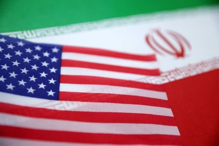 Illustration shows U.S. and Iran flags