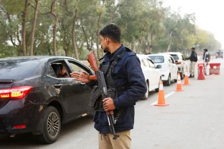 A police officer controls traffic flow as a security measure,