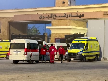 FILE PHOTO: Ambulances and aid trucks bound for Gaza at
