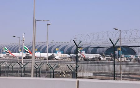 Planes are parked at Terminal 3 of the Dubai International