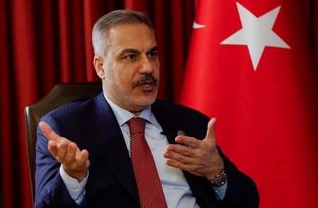 Turkish Foreign Minister Hakan Fidan speaks during an interview with