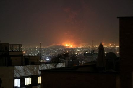 Smoke rises following an explosion, amid the U.S.-Israeli conflict with