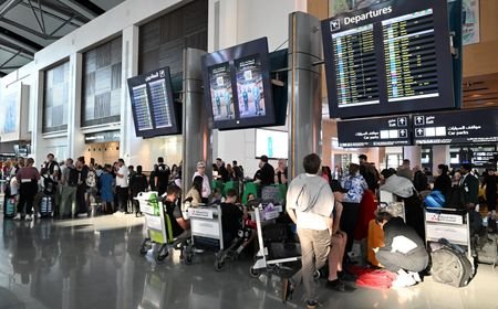 Passengers wait at Muscat International Airport as the Sultanate of