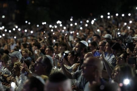 People attend the ‘Light Over Darkness’ vigil in Sydney