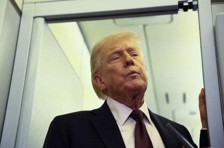 Trump speaks to reporters aboard Air Force One