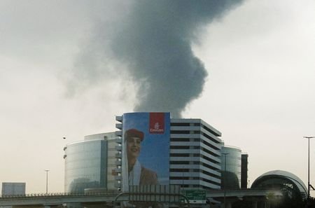 Smoke rises from the Dubai International Airport