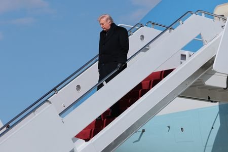 U.S. President Trump disembarks Air Force One as he arrives