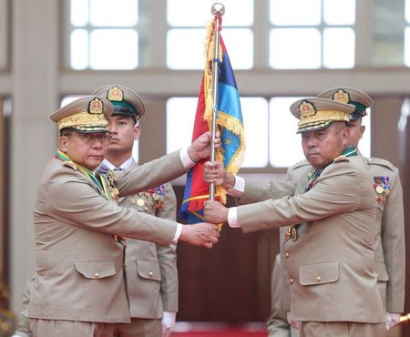 Myanmar junta chief Senior General Min Aung Hlaing hands over