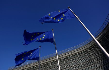 FILE PHOTO: European Union flags flutter outside the European Commission