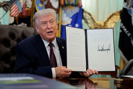 U.S. President Trump signs an executive order in the Oval
