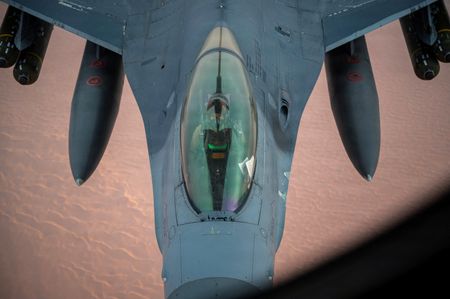 A U.S. Air Force F-16 Fighting Falcon aircraft refuels from