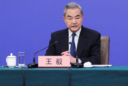 Chinese Foreign Minister Wang Yi attends a press conference on