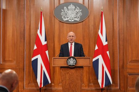 Britain's Defence Secretary John Healey delivers a statement at No.9