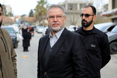 Hezbollah Member of Parliament Ali Fayyad stands in Burj al-Muluk,