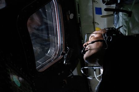 Circling the moon, a Black astronaut inspires millions