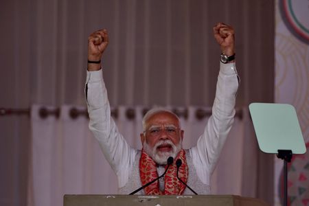 IIndia's Prime Minister Modi addresses his supporters during a public