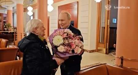 Russian President Vladimir Putin meets his former school teacher in