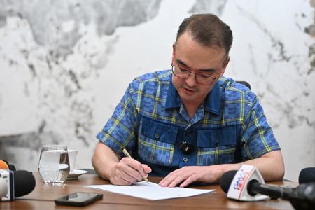 Philippine Senate President Alan Peter Cayetano signs the confirmation letter