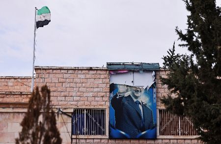 People gather to celebrate after the ousting of Syria's Bashar