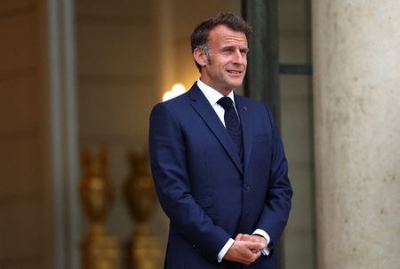 French President Emmanuel Macron waits for the arrival of a