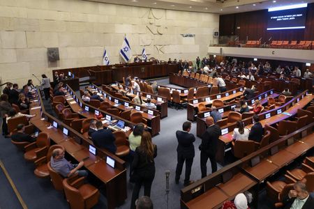 Israeli politicians react following a vote to dissolve the Knesset