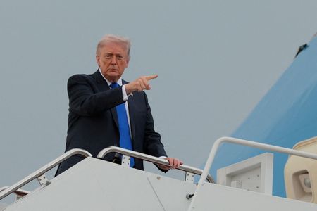 FILE PHOTO: U.S. President Donald Trump boards Air Force One