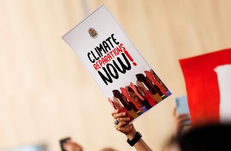 Activists protest to urge world leaders to commit to a
