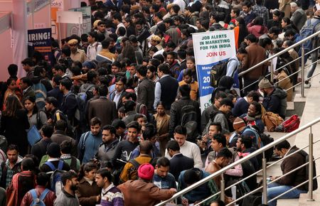 Job seekers attend a job fair organised by the employment