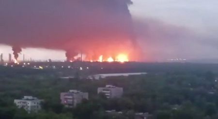 FILE PHOTO: Fire and a thick plume of smoke rise