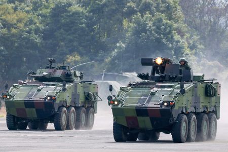 FILE PHOTO: Soldiers operate CM-32 armored vehicles during the annual