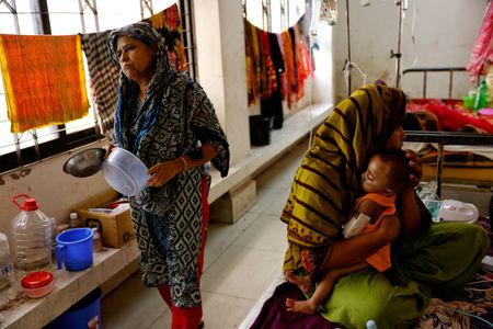 FILE PHOTO: Measles infected child receives treatment at the Infectious