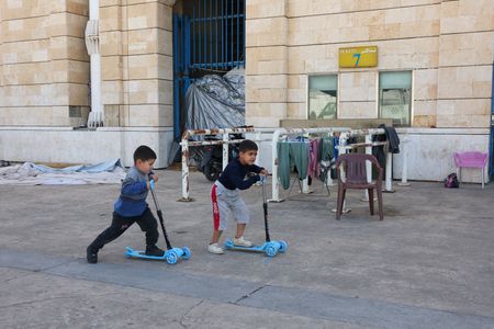 Displaced people shelter at Camille Chamoun Sports City stadium in