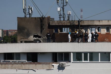 Law enforcement work on the site of an explosion at