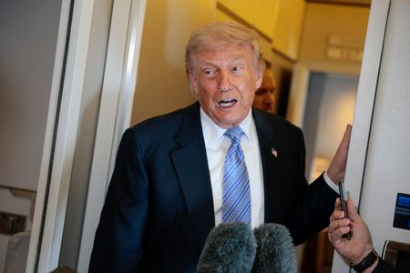 FILE PHOTO: U.S. President Donald Trump speaks to members of