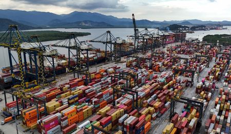A drone view shows ships and containers at the Port