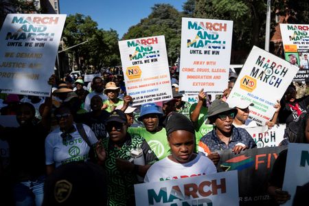 FILE PHOTO: Civil society groups and human rights organisations march