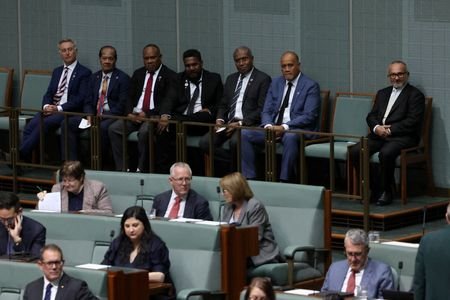 Solomon Islands Prime Minister Matthew Wale and his delegation listen