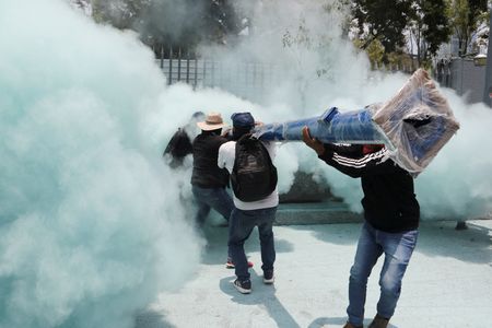 Teachers from Mexico's CNTE union protest for higher wages, in
