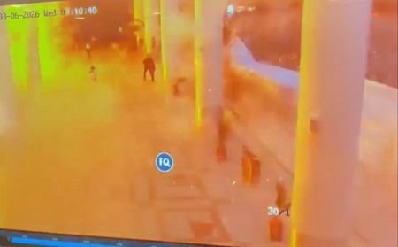A CCTV footage shows people running for cover following a