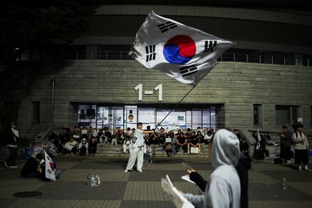 Demonstrators protest at a vote-counting centre over a shortage of