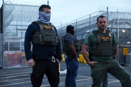 ICE agents stand outside Delaney Hall in Newark