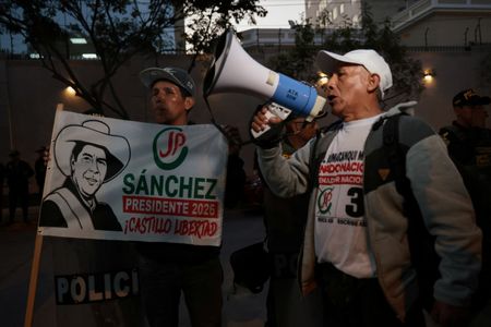 Supporters of left-wing presidential candidate Sanchez gather outside the National