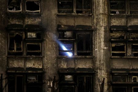 FILE PHOTO: The Wider Image - Hong Kong fire: Echoes