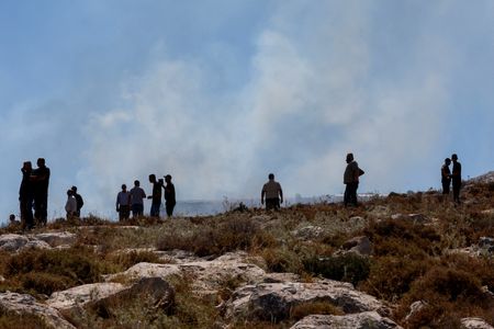 Palestinians protest against a settlement near Hebron