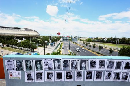 Missing-person flyers posted by members of the Fuerzas Unidas por